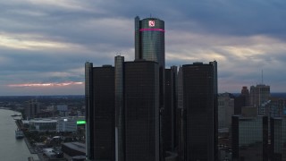 DX0002_192_042 - 5.7K aerial stock footage orbit the GM Renaissance Center skyscraper at sunset, Downtown Detroit, Michigan
