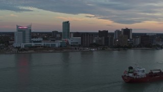 DX0002_192_047 - 5.7K aerial stock footage of the city's skyline seen from the river, Windsor, Ontario, Canada, sunset