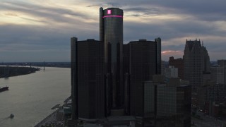 DX0002_192_050 - 5.7K aerial stock footage circling the GM Renaissance Center skyscraper at sunset, Downtown Detroit, Michigan
