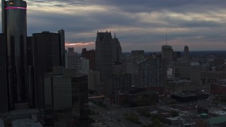 DX0002_192_053 - 5.7K aerial stock footage flyby GM Renaissance Center and skyscrapers at sunset, Downtown Detroit, Michigan