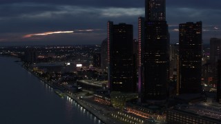 DX0002_193_009 - 5.7K aerial stock footage stationary view of GM Renaissance Center and Detroit River at twilight, Downtown Detroit, Michigan