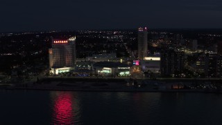 DX0002_193_014 - 5.7K aerial stock footage stationary view of Caesar Windsor hotel and casino at night, Windsor, Ontario, Canada