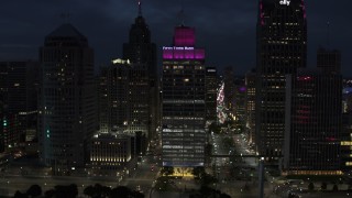 DX0002_193_017 - 5.7K aerial stock footage of the One Woodward Avenue skyscraper at twilight, Downtown Detroit, Michigan