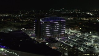 DX0002_193_019 - 5.7K aerial stock footage of lights on the MotorCity Casino Hotel building at night, Detroit, Michigan