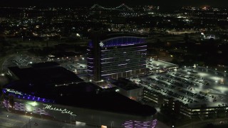 DX0002_193_021 - 5.7K aerial stock footage orbiting lights on the MotorCity Casino Hotel building at night, Detroit, Michigan