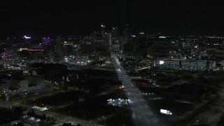 DX0002_193_023 - 5.7K aerial stock footage the city's skyline at night while passing Grand River Avenue, Downtown Detroit, Michigan