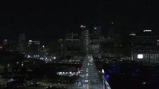 DX0002_193_032 - 5.7K aerial stock footage of the skyline at night during descent over Grand River Avenue, Downtown Detroit, Michigan