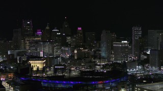 DX0002_193_051 - 5.7K aerial stock footage ascend from Comerica Park and skyline at night, Downtown Detroit, Michigan