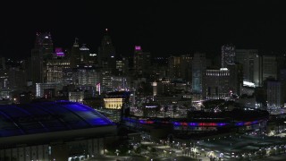 DX0002_193_052 - 5.7K aerial stock footage flyby sports stadiums and skyline at night, Downtown Detroit, Michigan