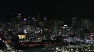DX0002_193_055 - 5.7K aerial stock footage fly past and away from Comerica Park and skyline at night, Downtown Detroit, Michigan