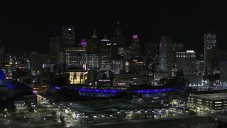 DX0002_193_056 - 5.7K aerial stock footage fly past Comerica Park and skyline at night, Downtown Detroit, Michigan
