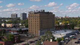 DX0002_194_013 - 5.7K aerial stock footage of a stationary view of an apartment building in Detroit, Michigan