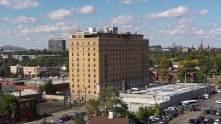 DX0002_194_014 - 5.7K aerial stock footage of orbiting an apartment building in Detroit, Michigan