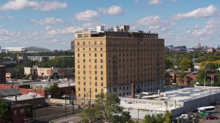 DX0002_194_015 - 5.7K aerial stock footage of circling an apartment building in Detroit, Michigan