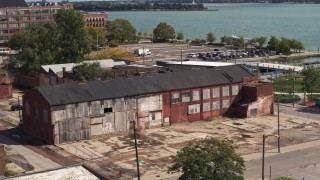 DX0002_194_017 - 5.7K aerial stock footage of orbiting an abandoned factory building in Detroit, Michigan