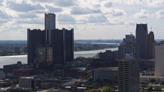 DX0002_194_029 - 5.7K aerial stock footage of GM Renaissance Center overlooking the river in Downtown Detroit, Michigan