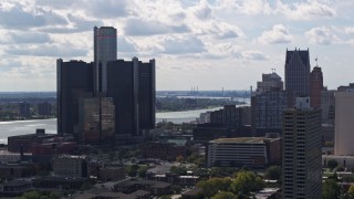 DX0002_194_030 - 5.7K aerial stock footage of orbiting GM Renaissance Center overlooking the river in Downtown Detroit, Michigan