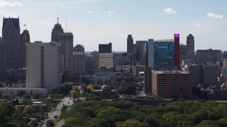 DX0002_194_042 - 5.7K aerial stock footage of churches between office tower and the hotel and casino, Downtown Detroit, Michigan