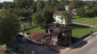 DX0002_195_004 - 5.7K aerial stock footage approach and orbit a demolished home in Detroit, Michigan