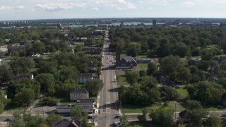 DX0002_195_011 - 5.7K aerial stock footage of a church on Mt Elliott Street in an urban neighborhood, Detroit, Michigan