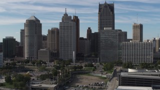 DX0002_196_004 - 5.7K aerial stock footage orbit and approach towering skyscrapers across from Hart Plaza, Downtown Detroit, Michigan