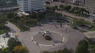 DX0002_196_023 - 5.7K aerial stock footage orbit and approach fountain in Hart Plaza in Downtown Detroit, Michigan