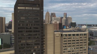 DX0002_196_028 - 5.7K aerial stock footage flyby a group of skyscrapers to reveal office tower in Downtown Detroit, Michigan