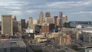 DX0002_196_030 - 5.7K aerial stock footage of flying by an office tower to reveal skyscrapers, Downtown Detroit, Michigan