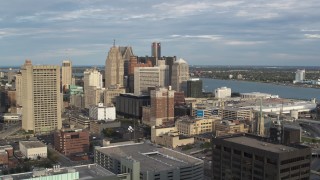 DX0002_196_038 - 5.7K aerial stock footage of a slow, wide orbit of a group of skyscrapers in Downtown Detroit, Michigan