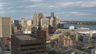 DX0002_196_039 - 5.7K aerial stock footage view of a group of skyscrapers, descend to reveal office tower in Downtown Detroit, Michigan