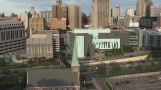 DX0002_196_040 - 5.7K aerial stock footage a reverse view of Detroit Public Safety Headquarters in Downtown Detroit, Michigan