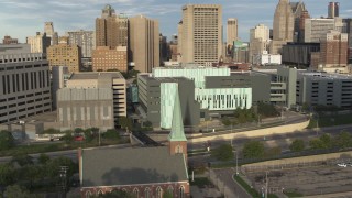 DX0002_196_041 - 5.7K aerial stock footage of orbiting the Detroit Public Safety Headquarters in Downtown Detroit, Michigan