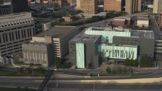 DX0002_196_045 - 5.7K aerial stock footage descend while focused on the Detroit Public Safety Headquarters in Downtown Detroit, Michigan