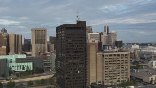 DX0002_196_048 - 5.7K aerial stock footage orbit the Executive Plaza Building in Downtown Detroit, Michigan