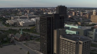 DX0002_196_049 - 5.7K aerial stock footage of circling the Executive Plaza Building in Downtown Detroit, Michigan