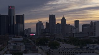 DX0002_197_027 - 5.7K aerial stock footage flyby top of building to reveal the city's skyline at sunset, Downtown Detroit, Michigan