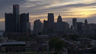 DX0002_197_030 - 5.7K aerial stock footage focus on GM Renaissance Center and the city's skyline at sunset during descent, Downtown Detroit, Michigan
