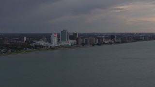 DX0002_197_044 - 5.7K aerial stock footage of the city's skyline across the river at sunset, Windsor, Ontario, Canada