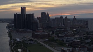 DX0002_197_046 - 5.7K aerial stock footage of the city's tall skyscrapers at sunset, Downtown Detroit, Michigan