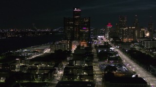 DX0002_198_040 - 5.7K aerial stock footage of orbiting GM Renaissance Center at night, Downtown Detroit, Michigan