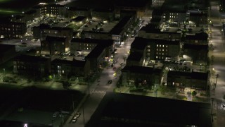 DX0002_198_052 - 5.7K aerial stock footage approach and orbit Franklin Street and an apartment complex at night, Downtown Detroit, Michigan
