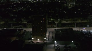 DX0002_198_056 - 5.7K aerial stock footage of an apartment building at night, Detroit, Michigan