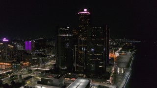 DX0002_199_029 - 5.7K aerial stock footage orbit and approach GM Renaissance Center at night, Downtown Detroit, Michigan