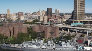 DX0002_200_009 - 5.7K aerial stock footage flyby apartment buildings, skyline, and USS Little Rock, Downtown Buffalo, New York