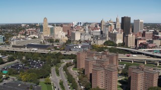 DX0002_200_010 - 5.7K aerial stock footage of the city's skyline seen while passing apartment buildings, Downtown Buffalo, New York