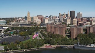 DX0002_200_013 - 5.7K aerial stock footage ascend over apartment buildings to approach skyline, Downtown Buffalo, New York