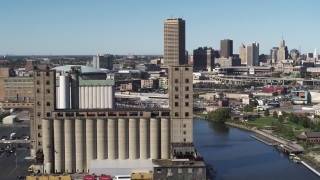 DX0002_201_021 - 5.7K aerial stock footage ascend and orbit a grain elevator in Buffalo, New York