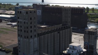 DX0002_201_023 - 5.7K aerial stock footage circling a large grain elevator in Buffalo, New York