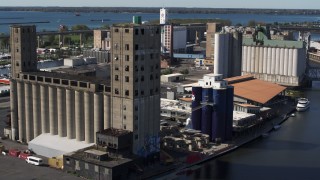 DX0002_201_025 - 5.7K aerial stock footage of an orbit around a large grain elevator in Buffalo, New York