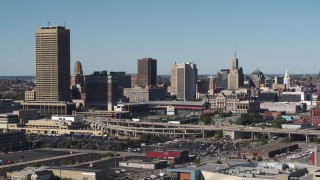 DX0002_201_028 - 5.7K aerial stock footage of flying by the city's skyline behind Sahlen Field baseball stadium, Downtown Buffalo, New York
